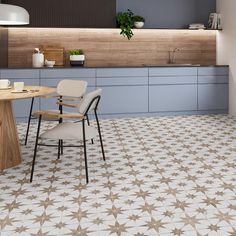 a table and chairs in a room with tile flooring that looks like it has stars on it