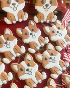 many decorated cookies are arranged on a table