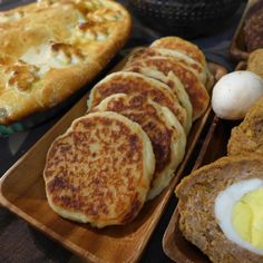 several different types of food on wooden trays