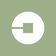 a white circle with an arrow in the center on a light green background that appears to be part of a web page