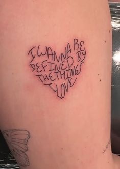 a woman's arm with writing on it that says, i wanna to be loved by something else