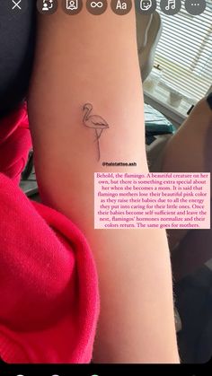 a person with a small tattoo on their arm that has a pink flamingo in it