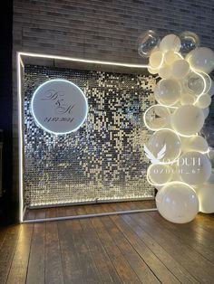 a room with some lights and balloons on the floor in front of a mirror wall