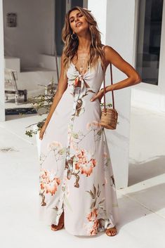 We're really into maxis at the moment and our Sounds Of Summer Maxi Dress has our hearts racing! This style has a tie front bust, adjustable shoulder straps and it buttons down the front. This style looks street style chic when layered over a white tee and paired with slides - our FAVES are the Dayla slides from BILLINI. Beige dress. Partially lined. Cold hand wash only. Model is a standard XS and is wearing XS. True to size. Non stretchy fabric. No zipper, button up style. Print placement may vary. Polyester. Button Dresses For Women, Casual Spring Dress With Knotted Straps, Spring Maxi Dress With Knotted Straps For Day Out, Casual Tie Waist Maxi Dress For Spring, Casual Spring Maxi Dress With Tie Waist, Summer Maxi Dress With Knotted Straps For Day Out, Spring Maxi Dress With Tie Fastening For Brunch, Spring Maxi Dress With Tie Fastening, Casual Summer Maxi Dress With Knotted Straps