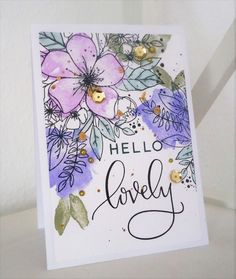 a card with watercolor flowers and the words hello lovely