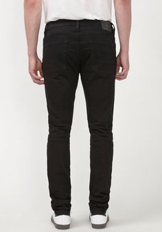 Step into style with the Skinny Max Men's Jeans in Midnight Wax. These striking jeans feature a unique crinkled dark denim finish, adding both texture and trendy attitude to your look. They are designed with a regular rise and a skinny fit that follows the leg to the hem, delivering a modern silhouette perfect for any fashion-forward guy. The classic five-pocket styling, complemented by a zip fly and a distinctive Buffalo rivet at the rear pocket, makes these jeans a timeless addition to your wa Black Slim Bottoms With Five Pockets, Black Rigid Denim Jeans With Pockets, Black Rigid Denim Jeans For Streetwear, Black Slim Fit Elastane Jeans, Urban Black Rigid Denim Jeans, Urban Black Slim Fit Jeans, Black Full-length Rigid Denim Jeans, Dark Denim, Black Denim