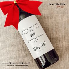 a bottle of wine with a red bow on it and the label says, i heard you were born this year