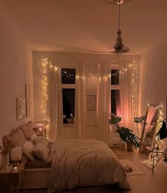 a bedroom decorated with lights and fairy lights