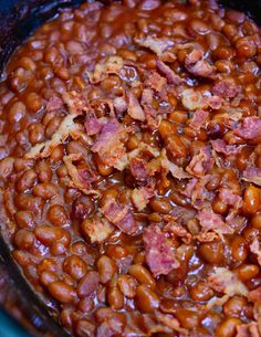 cooked beans and bacon in a crock pot ready to be served for lunch or dinner