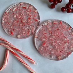 two plates with candy canes and candies on them