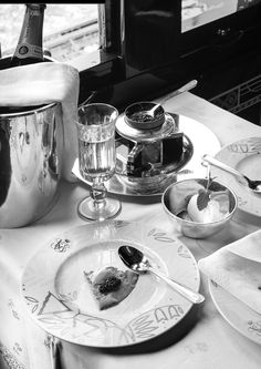 a table topped with plates and bowls filled with food