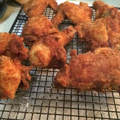 some fried food is sitting on a cooling rack