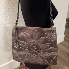 Bronze Leather With Embossed Sunflower Shoulder Bag With Silver Hardware Bag Width 10 In, Bag Height 8 In, Bag Depth 7 In Brighton Bags, Ar Accessories, Walker Boots, Fit N Flare Dress, Boot Sandals, Rain And Snow Boots, Silver Hardware, Snow Boots, Embossed Leather