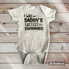 Cute, Funny Little Onesie, That Says: I Was Daddy’s Fastest Swimmer. Made With A Creations Of Grace, Onesie And Premium Vinyl Size Might Vary Based On Suppliers Used For Onesies How Rest Assured It Will Be The Size Equivalent Smoke Free Home Bundle To Save Family Matching Black Cotton Onesie, Fitted Cotton Casual Onesie, Fun Black Cotton Onesie, Casual Unisex Onesie With Letter Print, Cute Gray Cotton Onesie, Fitted Crew Neck Casual Onesie, Fitted Casual Crew Neck Onesie, Gray Summer Playwear For Babies, Gray Cotton Onesie For Playtime