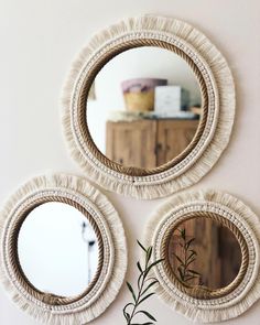 three round mirrors hanging on the wall