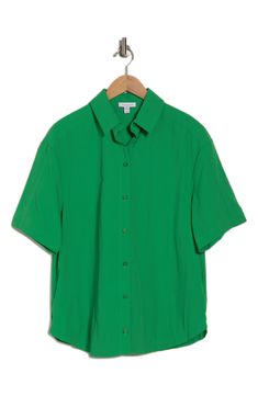 Throw on this short-sleeve button-up shirt constructed in a boxy, oversized fit that's easy to layer. Front button closure Spread collar Short sleeves 100% nylon Machine wash, line dry Imported Green Short Sleeve Camp Collar Shirt, Green Camp Collar Top With Button Closure, Green Solid Color Button-up Top, Green Button-up Top With Patch Pockets, Green Button-up Camp Shirt With Pockets, Short Sleeve Button Up, Oversized Fits, Nordstrom Rack, Short Sleeve Shirt