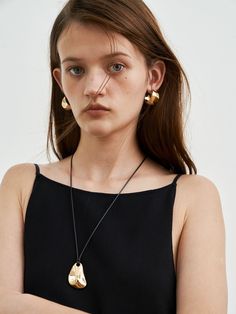 Editor's NoteRAWEL is a contemporary jewelry brand that embraces a sense of tasteful minimalism. With ethically and sustainably sourced materials and a refined design sensibility  it offers timeless classic and effortless elegance jewelry that transcends seasonal trends.- Unique curved triangular pendant- Polished and smooth surface- Leather string strap- 18K gold or sterling silver plated- Bold and uniquely structured silhouette- Feminine and classic moodMeasurements (In.)One Size- Size: 28.35 Jewelry Brand, Effortless Elegance, Accessories Jewelry Necklace, Contemporary Jewelry, Zipper Bags, Women Accessories Jewelry, Timeless Classic, Jewelry Branding, Leather Straps