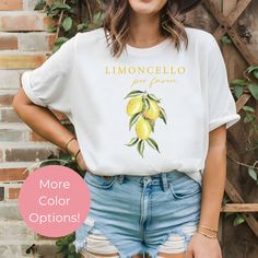 This Limoncello Por Favore Shirt, a delightful blend of style and zest, perfect for those who appreciate the finer things in life. This Lemon T-Shirt combines a fresh, vibrant design with the playful phrase "Limoncello Por Favore," making it a standout piece in any wardrobe. It's a charming nod to Italy's beloved lemon liqueur, Limoncello, and a stylish way to show appreciation for Italian culture. All of our shirts are made with the highest quality materials and are super soft and cozy! ♥ HOW T White T-shirt With Lemon Print For Summer, Casual Cotton T-shirt With Lemon Print, Yellow T-shirt With Lemon Print For Spring, Spring Lemon Print Cotton Top, Spring Cotton T-shirt With Lemon Print, Casual Lemon Tops For Summer, Spring Cotton Tops With Lemon Print, Casual Lemon Print Tops For Spring, Spring Cotton Top With Lemon Print