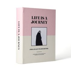 a pink and white book with the title life is a journey