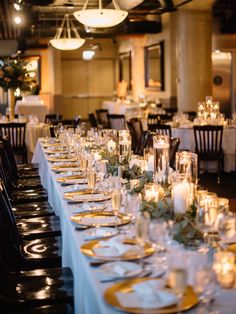 a long table is set up with candles and place settings for an elegant dinner party