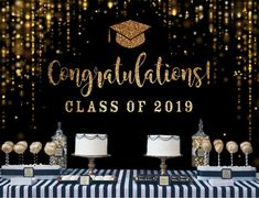 congratulations class of 2019 cake table with gold confetti and black and white striped tablecloth