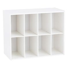 a white shelving unit with six cubbys on the bottom and four shelves below