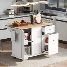 a kitchen island with two drawers and a cutting board on it