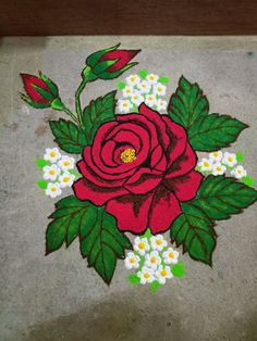 a red rose painted on the ground with white and green flowers in it's center