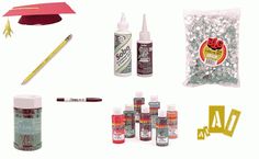 an assortment of arts and crafts supplies including a graduation cap, pencils, markers, glue, paper