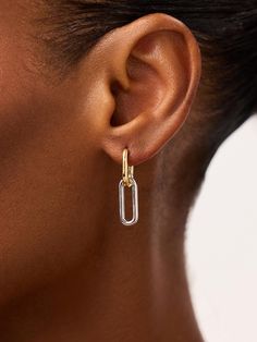 Too-cool and two-toned, these gold drop earrings plated in 14k gold and rhodium feature two hoops and a bold mixed metal design made to elevate every stack. Sleek Earrings, Metal Drop, Gold Drop Earrings, Letter Necklace, Mixed Metals, Metal Design, Two Tone, Sleek, Plating