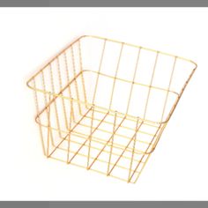 a gold wire basket is shown against a white background, with the bottom section missing