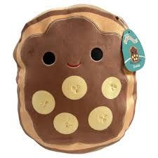 a brown and yellow stuffed animal with buttons on it's face