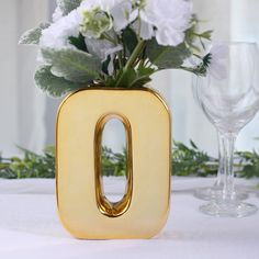 $7.99 | Add a touch of luxury to your decor with this gorgeous ceramic letter vase. It's crafted from high-quality ceramic and features a lustrous metallic gold finish that adds instant glamour to any space. The top opening makes it easy to insert flowers or other decorative items, and the alphabet design means you can spell out any word or phrase you like. Whether you use it as a centerpiece or as a fun way to personalize your home or event decor, this vase is sure to make a statement. Letter O