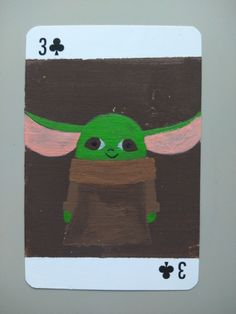 a playing card with an image of a baby yoda