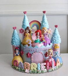 there is a birthday cake with princesses on it