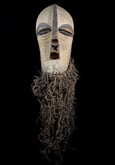 Songye Kifwebe mask.  36 cm high x 20 cm wide x 23 cm deep. Original antique female Songye mask used in tribal ceremonies. Acquired in Africa more than 25 years ago and ever since in private collection. This wooden mask has everything: a quite complete rafia beard and raffia fiber textile cover behind as seen on pictures, beautifulpatina, age... We believe it is a mask for serious collectors or institutions. The wooden part is 36 cm long, extending to 90 cm with the raffia beard.  General good c Wooden Mask, Fibres Textiles, A Plus, A Mask, X 23, Sculpture Art, Eyebrows, 20 Cm, Patina