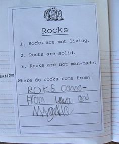 an open book with writing on it that says rocks are not living 2 rocks are solid 3 rocks are not man made