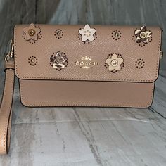 Coach Fold Over Wristlet With Daisy Appliqus. Gold Hardware. You Can Add A Purse Strap To Use It As A Crossbody. Outside Zipper Pocket. Slot On Inside For Phone. I Can Fit My Xs Max In It. Two Credit Card Slots. Taupe With Python Print On Sides. Python Print, Purse Strap, Gold Hardware, Coach Bags, Card Slots, Continental Wallet, Credit Card, Zipper Pocket, Daisy