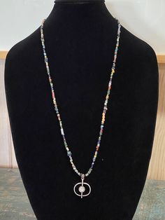 "Astral Orbit Pendant, the pendant represents Astral Meaning: the non-physical realm of existence is the counterpart which is the human body. It is a sophisticated Boho look. Long rope length beaded necklace, 31\". MaRV premium bead mix includes, but not limited to; Ancient Djenne beads, ancient African trade beads, ancient Roman glass beads, Labradorite, faceted hematite, genuine turquoise, ancient Venetian glass, TOHO seed beads, garnet, lapis, Czech fire polished glass, peridot, or quartz, cr Sophisticated Boho, Rome Antique, Long Rope, Ancient Roman Glass, Boho Choker, African Trade Beads, Roman Glass, Long Beaded Necklace, Venetian Glass