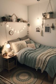 a bedroom with a bed, rugs and lights on the wall above it's headboard