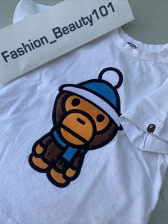 BAPE, A bathing ape tee-shirt made in japan embellished with velours applique  will fit kids about 7 years old. white background with Kaws Milo in front. Some very light stains on bottom front as shown on last photo. Pictures are part of the description. We appreciate your positive feedback.  We ship items within 2 business days from a smoke and pet free environment.  Professional Ebay seller.  We enjoy leaving feedback for the buyer that posts positive feedback.  & Bape Tyler The Creator, Bape Milo, Bape Art, Bape T Shirt, Bape Shirt, Baby Milo, Ape Bape, Personal Closet, Fit Kids