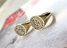 "gold college class rings in 10k and 14k solid gold, delicately engraved with your school logo or any other image or iintials you want ♡  the ring has solid back. deep and detailed engraving very delicately handcrafted unisex - looks super cool on both women & men  side or inside engravings cost 12 USD for both sides.  please contact us if you request side engravins or simply go back to our shop and purchase the \"Side or inside engraving fee\" listing. available in 4 round face sizes: small - 1 14k Gold Engraved Ring With Hallmarks For Commemoration, Personalized Gold Rings For Commemoration, Personalized Yellow Gold Commemorative Ring, Personalized Yellow Gold Commemoration Ring, Class Of 2024 Rings, Class Rings High School Reeds Jewelers, Graduation Rings College, College Class Ring, Class Rings College