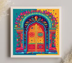 an art print of a colorful doorway with flowers and feathers on the table next to it