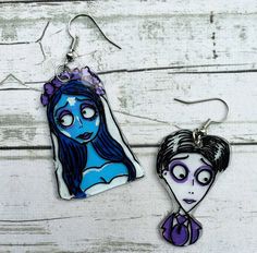 I love Tim Burton movies and Halloween is one of my favorite holidays. I am so in love with these earrings and I hope you are too. The corpse bride Emily and her groom Victor are a good size earring set. Characters are appropriately 1 inch long. *Hand drawn and painted *Hand made from start to finish. *Sterling silver hooks. 925 surgical sterling silver. *Super light and comfortable. *Earrings are sealed but extended time in the water such as swimming or showering is not recommended. *Items usua The Corpse Bride Emily, Victor And Emily, Tim Burton Movies, Corpse Bride Emily, Shrinky Dink Earrings, Crazy Earrings, The Corpse Bride, Spooky Earrings, Shrink Plastic Jewelry