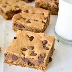 chocolate chip cookie bars sitting on top of white paper