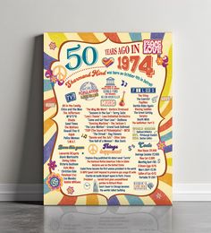 the 50th anniversary poster is on display in front of a white wall with an orange and yellow background