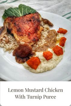 lemon mustard chicken with turnip puree on a white plate next to green leafy garnish