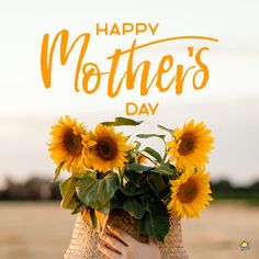 a woman holding a bouquet of sunflowers with the words happy mother's day