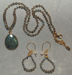 Hand knotted semi precious labradorite and 24k gold vermeil beads are featured in this lovely necklace and earring set. All metal is 24k gold vermeil (24k gold plated sterling silver) and sells as a set. The earrings are hand knotted also and match the necklace. If you are just interested in the earrings or the necklace please contact me before you purchase the jewelry because the price will change. If you are interested in this necklace set and would like more photos or have any questions please feel free to contact me. I usually answer all inquiries the same day. This set is ready to ship and would make a lovely gift. Thank You for looking. Gold Labradorite Round Bead Jewelry, Gold Labradorite Jewelry With Faceted Beads, Elegant Faceted Labradorite Jewelry, Elegant Jewelry With Faceted Labradorite Beads, Gold Faceted Labradorite Jewelry, Necklace And Earring Set, Lovely Necklace, Atlanta Ga, Gold Plated Sterling Silver