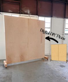 a large piece of plywood in a warehouse with the words digital diy plans on it